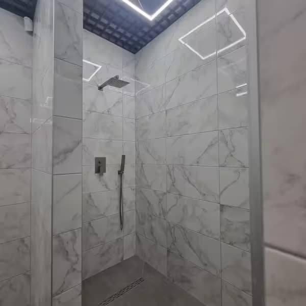 Shared bathroom facilities at Aurinia XO Hostel